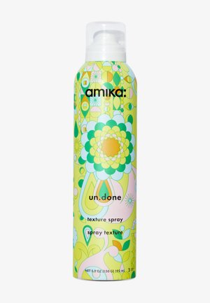 Amika un.done Texture Spraydose mit bunten grünen, gelben und pinken Blumen- und geometrischen Mustern und weißer Sprühdüsenkappe.