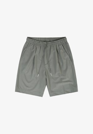 Light gray elastic waist shorts with drawstring, side pockets, subtle pleats, and metal zipper pull on the right pocket.