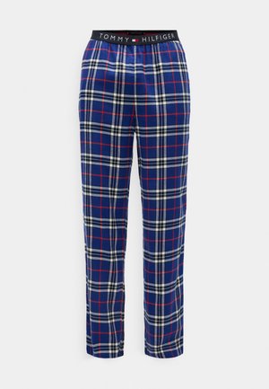 Pantalons de pyjama en tartan marine avec des rayures rouges et blanches. Tissu doux, taille élastique avec un logo "TOMMY HILFIGER", coupe droite.