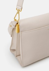 Coccinelle BINXIE - Handbag - white
