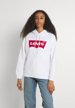 Sudadera blanca de algodón con un bolsillo canguro, con un gran logotipo rojo de Levi's en la parte frontal. Tejido texturizado con cordones ajustables.