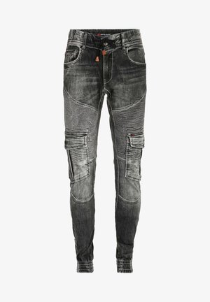Schwarze Denim-Cargo-Hosen mit schmalem Schnitt, mehreren Taschen, strukturiertem Besatz und elastischen Bündchen. Akzente setzen Kontrastnähte und ein Kordelzugbund.