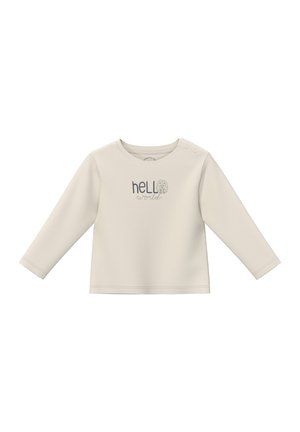 Langarm-Creme-Bluse mit rundem Ausschnitt, ausgestattet mit grauem Text, der "hello" über "world" abbildet, sowie Druckknöpfen an den Schultern für einfaches An- und Ausziehen.