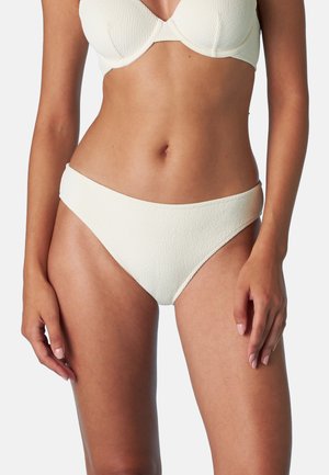Top bikini bianco a trama con ferretto, abbinato a slip bikini a vita bassa coordinati. Il materiale è a coste; il design senza cuciture aumenta il comfort.