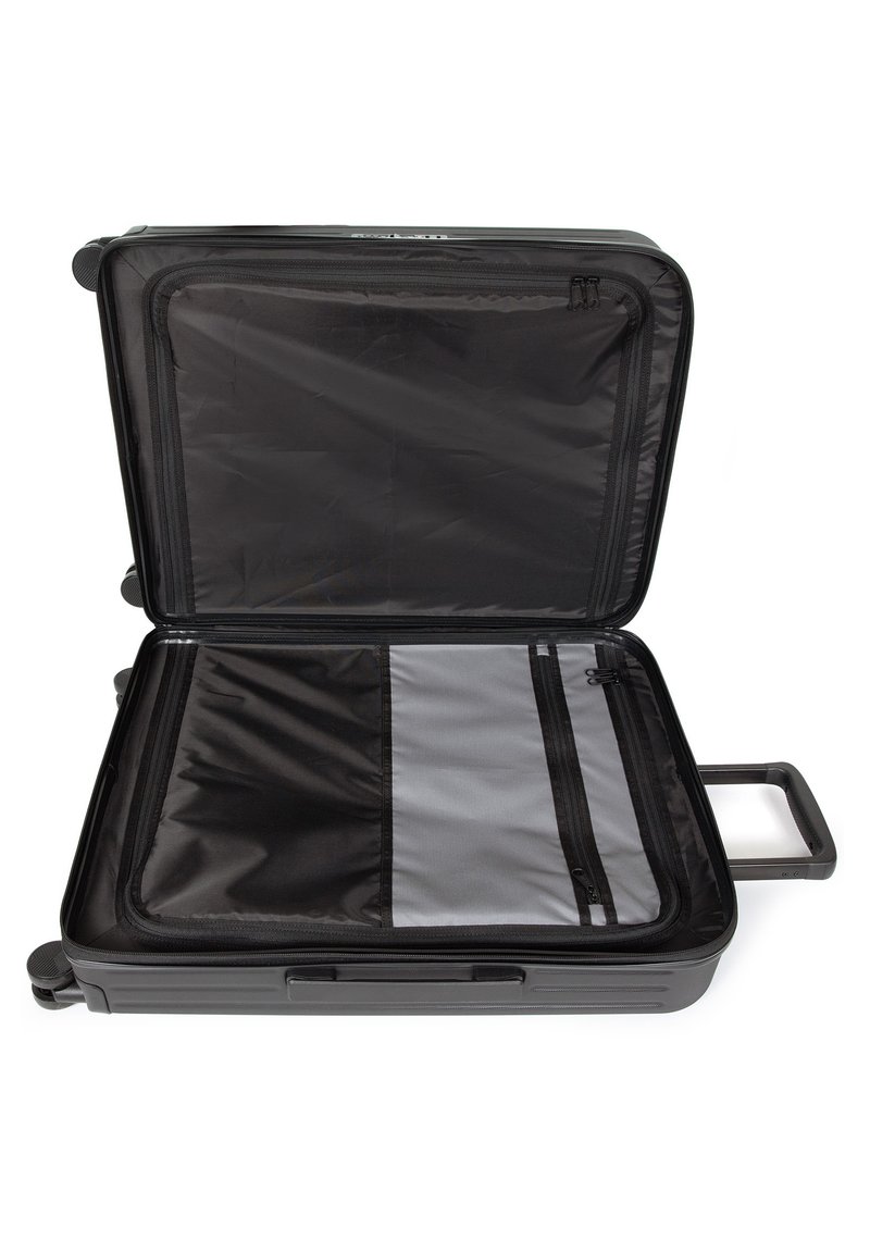 Valise noire avec une coque dure, compartiments intérieurs zippés et une poignée rétractable. Doublée de tissu gris pour une protection optimale.