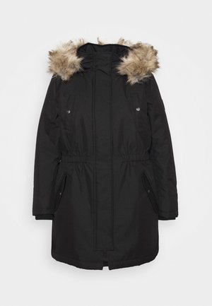 Melnā parka jaka ar mākslīgā kažoka oderētu kapuci, elastīgu jostas vietu, divām priekšējām kabatām un ar rāvējslēdzēju aizdari. Gluda, laikapstākļu izturīga auduma.