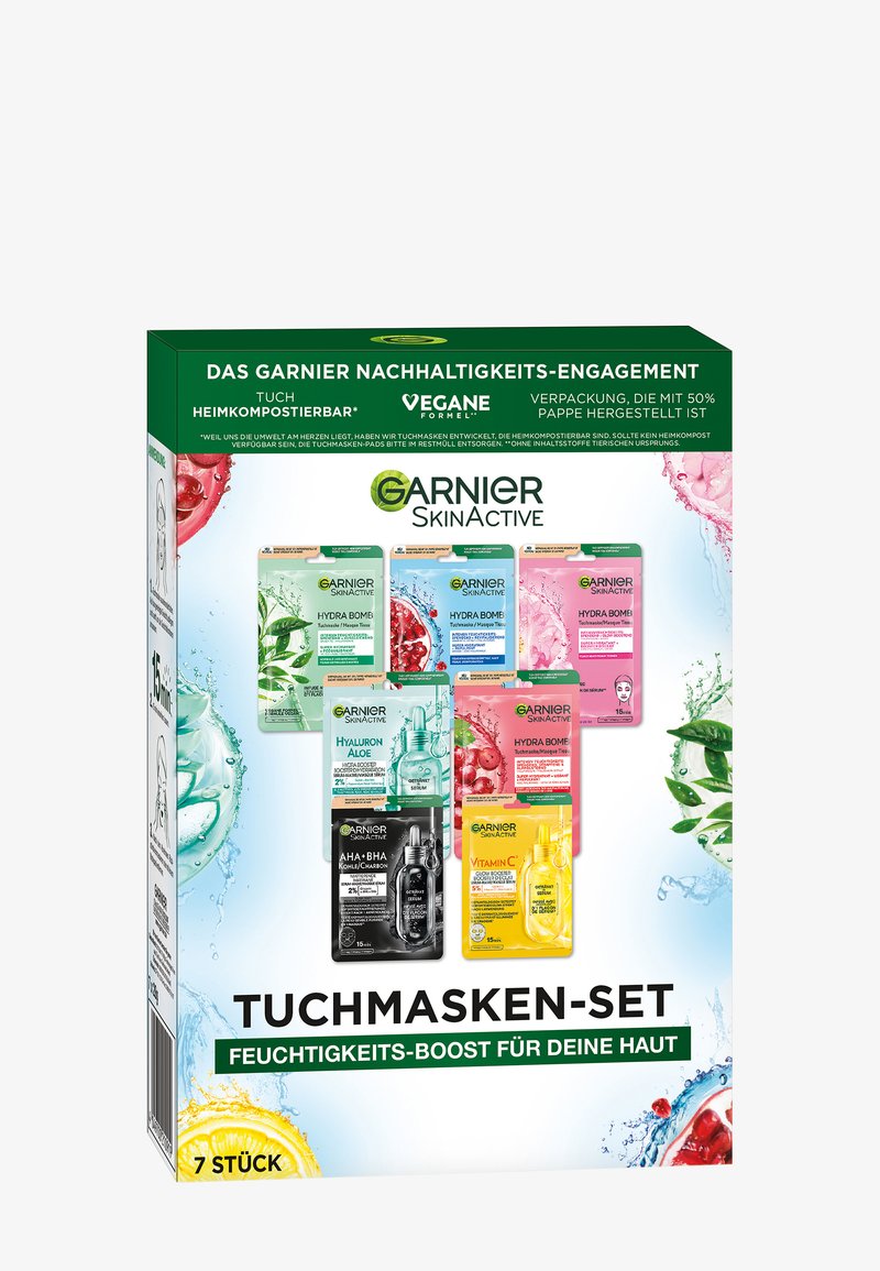 Emballage d'un ensemble de masques faciaux dans une boîte colorée présentant sept masques individuels avec des graphismes floraux et fruitiers, principalement verts, roses et bleus.