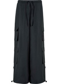 Pantalon cargo noir à jambes larges avec taille élastique, cordon de serrage et multiples poches à rabat sur les côtés.