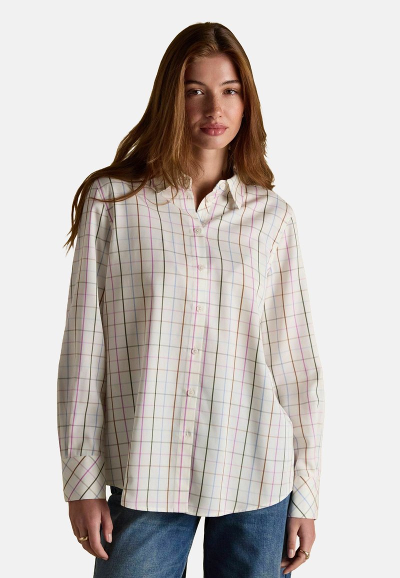 White long-sleeve shirt with multicolor grid pattern, button-down front, and pointed collar. Fabric appears lightweight and smooth.