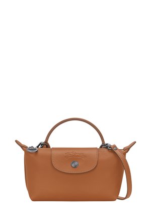 Brown leather handbag with a rounded shape, top handle, detachable strap, silver-tone hardware, and embossed logo detail on the front.