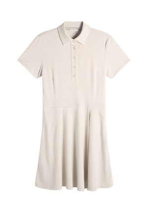 Jasnobeżowa polo sukienka z krótkim rękawem, kołnierzykiem, listwą na guziki, dopasowaną talią i rozkloszowaną spódnicą.
