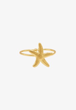 Bague en forme d'étoile de mer dorée avec une surface texturée, présentant un simple anneau rond et un design d'étoile de mer proéminent sur le dessus.