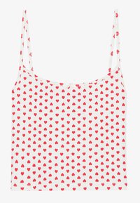 White sleeveless top with thin straps, featuring a pattern of small red hearts. Soft fabric with a decorative bow at the center front.