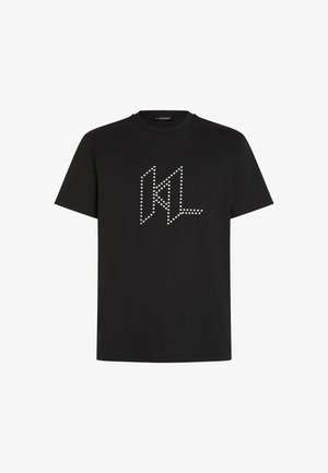 Melna kokvilnas T-kreklu, ar baltu studs KL logotipu priekšpusē. Īsas piedurknes un apaļa kakla izgriezums. Vienkāršs dizains.