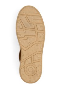 Rubberen schoenzool met een gestructureerd loopvlakpatroon, voornamelijk in beige kleur, met een circulair logo en maatmarkeringen.