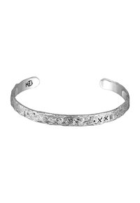 Silver bracelet with a textured, uneven surface, featuring engraved symbols. Open cuff design allows for easy wearing.