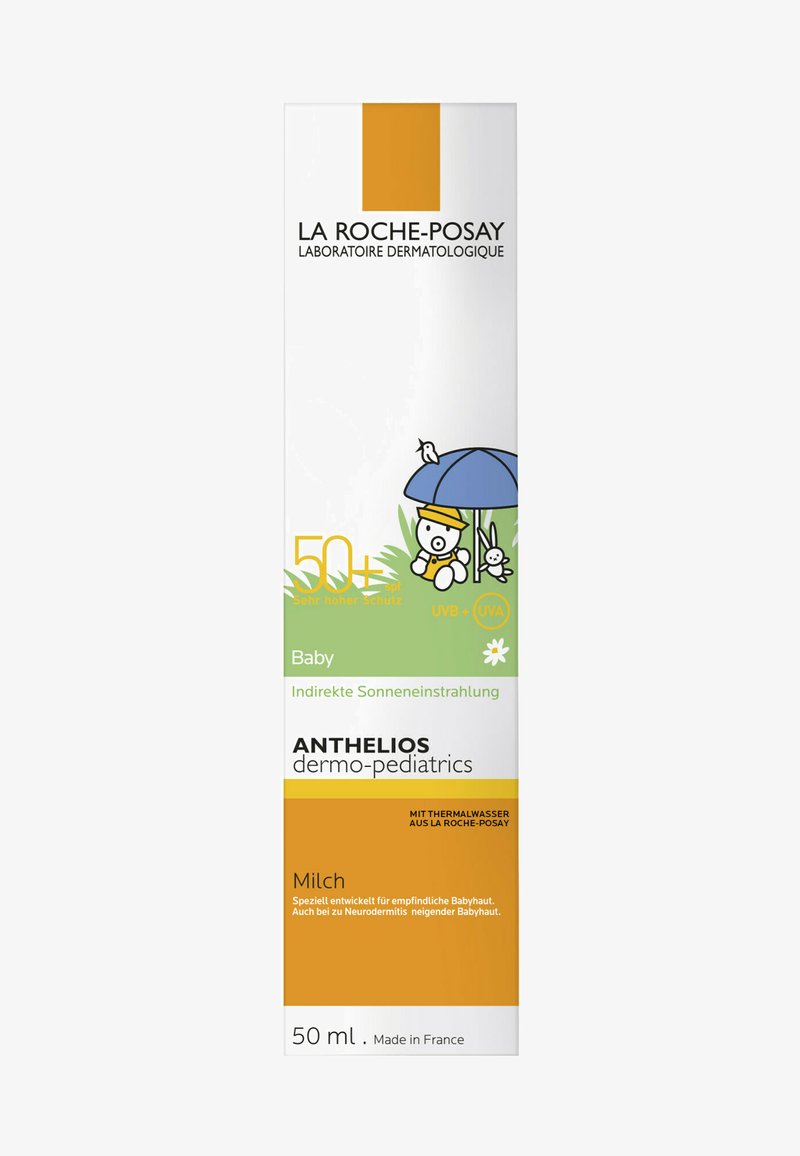 Sunscreen milk for babies in a 50 ml container. White box with green and yellow accents. Features a cartoon of a bear under an umbrella.