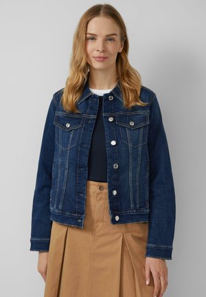 Dark blue denim jacket with a classic collar, button closure, and two chest pockets. Features visible stitching and a structured fit.