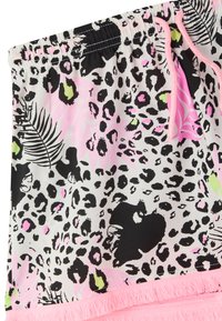 Tessuto leopardato in nero, rosa e verde con orlo frangiato rosa. Vita elastica con cordoncino per una vestibilità regolabile.