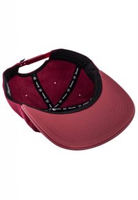 Red cap with a curved visor, black inner lining, and a moisture-wicking sweatband. Features stitching details and adjustable strap at the back.