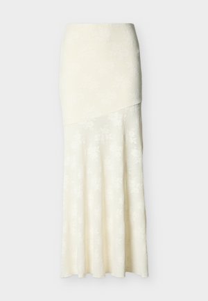 Elevandiluu lillelise pitsiga keskmise pikkusega seelik, millel on istuv vöökoht ja lehviv hemeleht ning asümmeetriline pealmine paneel.