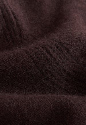 Brauner, weicher, strukturierter Stoff mit subtilen Variationen in Dicke und Webmuster, der ein warmes, flauschiges Erscheinungsbild zeigt.