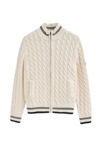 Krämfärgad kabelstickad zip-up tröja med hög krage, ribbade ärmslut och nederkant, med svarta och vita randiga detaljer samt två framfickor.