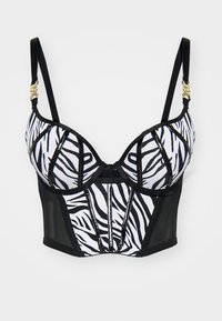 Reggiseno a stampa zebra in bianco e nero con coppe sagomate, lati in rete nera trasparente, spalline regolabili e dettagli in oro.