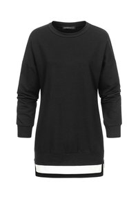 Black sweatshirt with long sleeves, relaxed fit, round neckline, and white stripe details at the hem. Zipper accents on the sides.