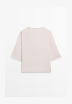 Light pink, loose-fit short-sleeve top with wide sleeves and a round neckline, shown from the back on a white background.