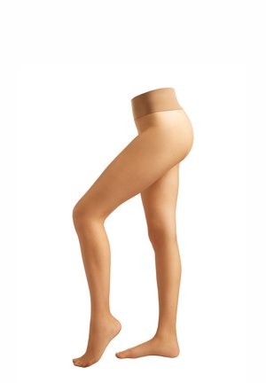 Leggings de color nude con una cinturilla sin costuras. Textura suave y ajuste ceñido al cuerpo. Presentan una forma natural de pierna y pie descubierto.