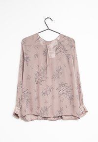 Světle růžová blůza s květinovým vzorem, vyrobená z průsvitné tkaniny. Má dlouhé rukávy s knoflíkovými manžetami a kulatým výstřihem.