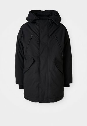 Black parka with a hood, featuring two zippered chest pockets, two flap side pockets, and a relaxed fit. Soft fabric with a smooth texture.