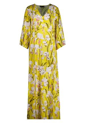 Kukallinen maksimekko kirkkaan keltaisena, jossa on valkoisia ja vaaleanpunaisia kukkakuoseja, V-pääntie ja kolmen neljänneksen pituiset hihat. Smooth-textuuri.