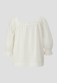 Blouse blanche à épaules dénudées avec des manches trois-quarts, en tissu texturé à petits pois, et avec des volants aux poignets et à l'ourlet.