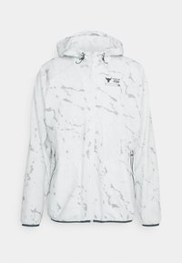 Veste blanche à capuche zippée avec motif marbré gris clair, deux poches latérales zippées et petit logo noir sur la poitrine.