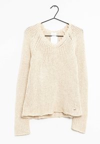 Krämfärgad, stickad tröja med rundad halsringning, ribbad fåll och något sänkta axlar. Har subtila texturmönster.