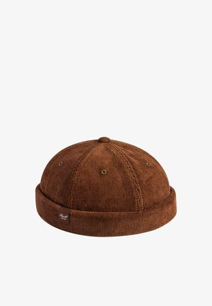 Brown corduroy dock worker cap with rolled brim and small fabric label on the side against a white background.
