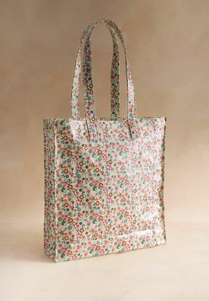 Torba na zakupy wielokrotnego użytku z długimi uchwytami, ozdobiona małym, wielokolorowym wzorem kwiatowym na jasnym tle.