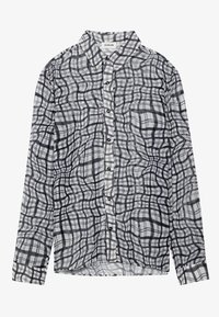 Chemise à manches longues présentant un motif à carreaux noir et blanc, avec une fermeture avant à boutons et une coupe décontractée, confectionnée dans un tissu léger.