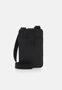 Black wallet with embossed "URBAN CLASSICS" text, rectangular shape, secure flap, and detachable strap for crossbody or handheld use.
