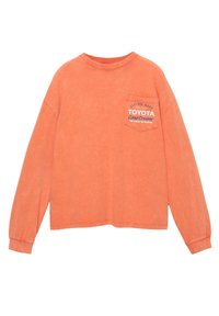 Oranžové bavlnené tričko s krátkym rukávom, okrúhlym výstrihom a predným vreckom s potlačeným logom "Toyota Land Cruiser".