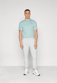 TravisMathew THE ZINNA - Polotričko - heather beryl green