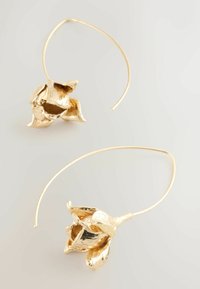 Gold hoop earrings designed as flower buds with textured petals and a smooth interior, featuring a long wire hook for secure wear.