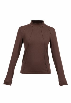 Brązowa bluzka z długim rękawem i stójką. Posiada przeszycia z przodu oraz dopasowany krój, wykonana z miękkiego, elastycznego materiału.