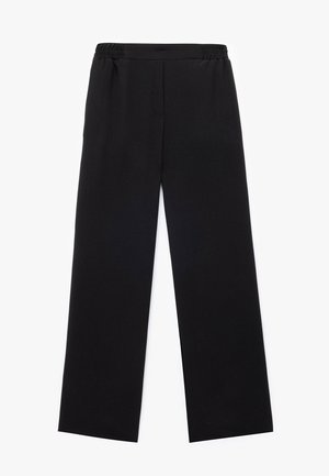 Pantalones de pierna ancha negros con cintura elástica, confeccionados en una tela suave, que presentan un diseño minimalista y sin cierres visibles.