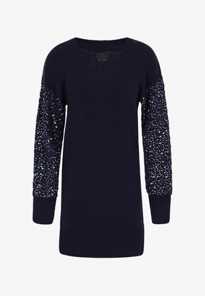 Marineblå sweater med V-udskæring og lange ærmer. Ærmerne har et struktureret mønster af perler langs skuldrene. Ribbet kant ved ærmer og forneden.