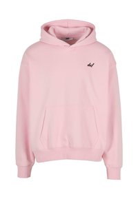 Light pink hoodie with a front pocket, drawstring hood, and a small black "def" logo on the left chest. Made of soft, smooth fabric.