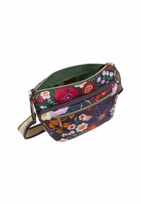 Borsa a tracolla in tessuto floreale multicolore con scomparto principale con cerniera, fodera interna verde e tracolla regolabile a fantasia.