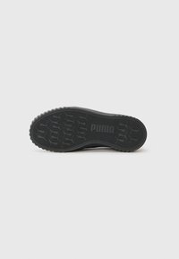 Black sneaker sole with textured rubber, featuring a patterned tread and "PUMA" logo embossed in the center. Rounded edges and slight curvature.